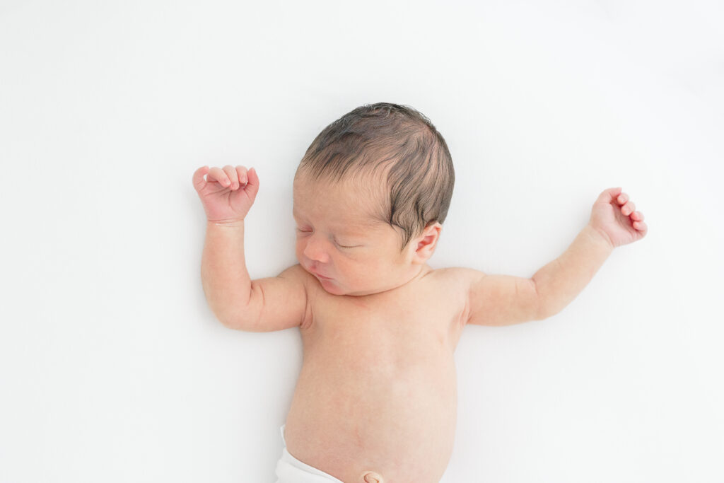 Family newborn portrait with parents and baby photographed in Fairfield County Connecticut