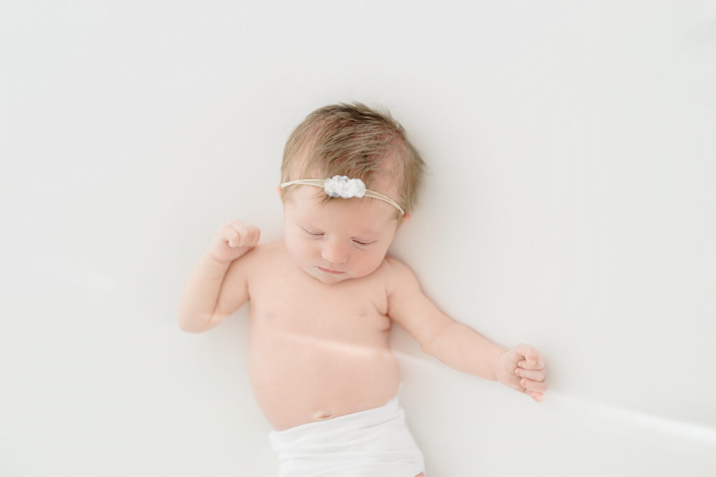 Professional newborn photographer capturing a sleeping baby portrait in Fairfield County Connecticut