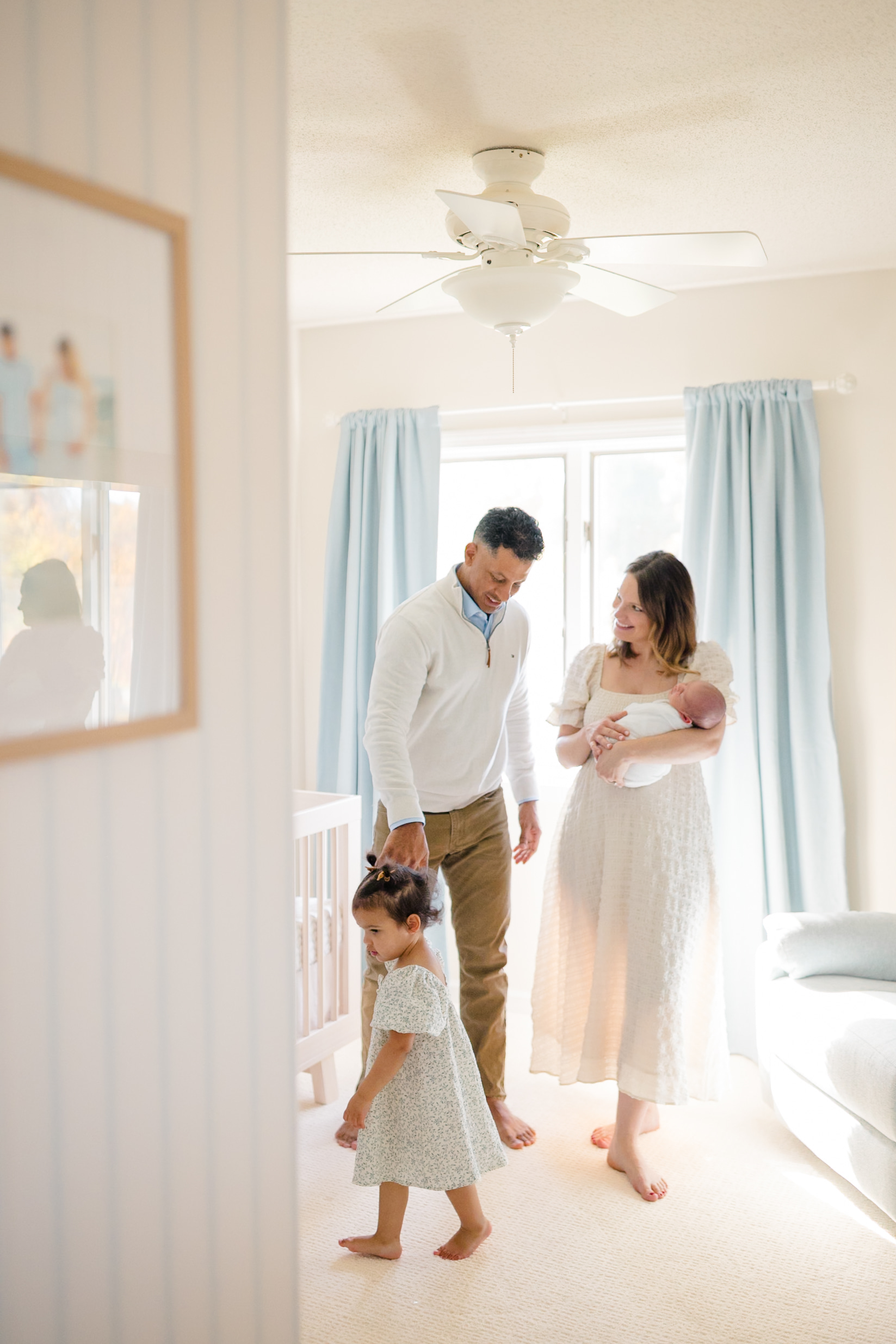 Newborn baby wrapped in soft neutral fabric during a newborn photography session in Fairfield County CT