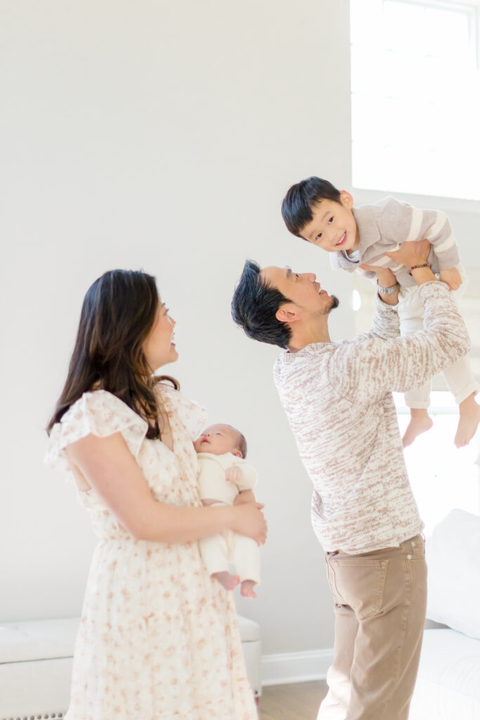 Preparing a newborn for a professional photography session in Fairfield County CT