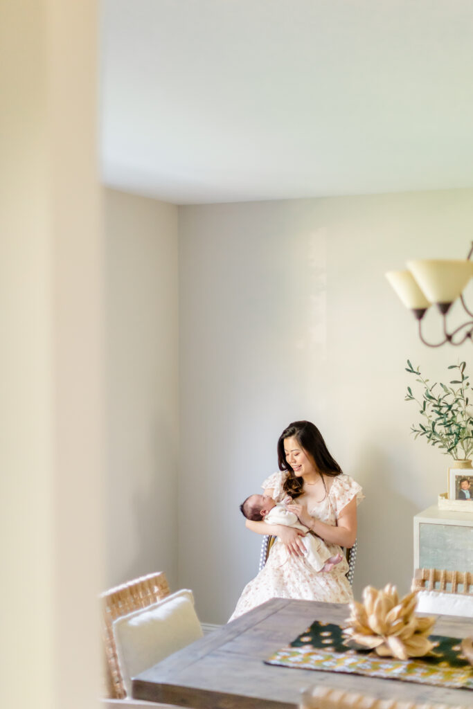 Parents holding their newborn during a family newborn photoshoot in Fairfield County