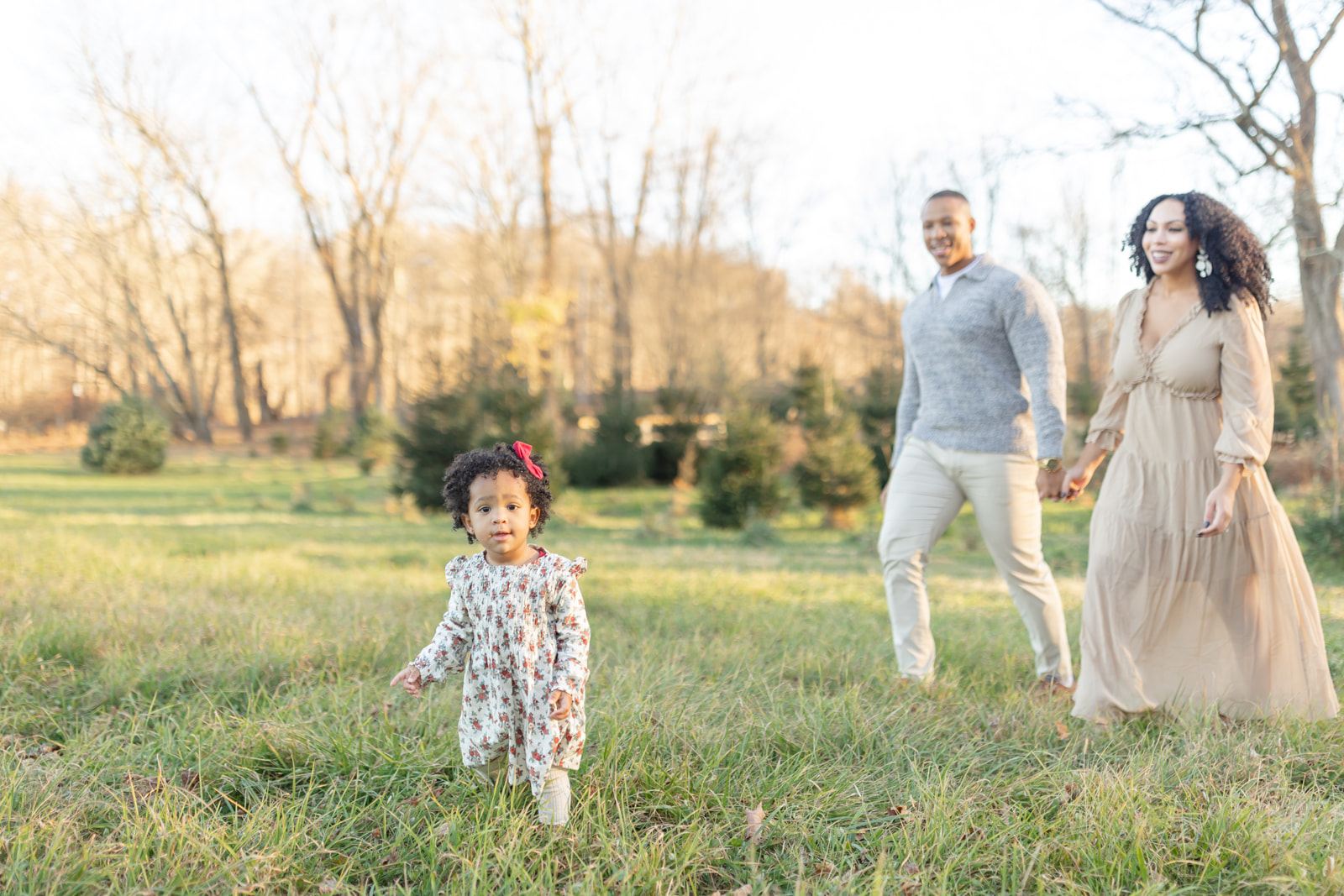 Family enjoying a Christmas tree farm photo session in Connecticut