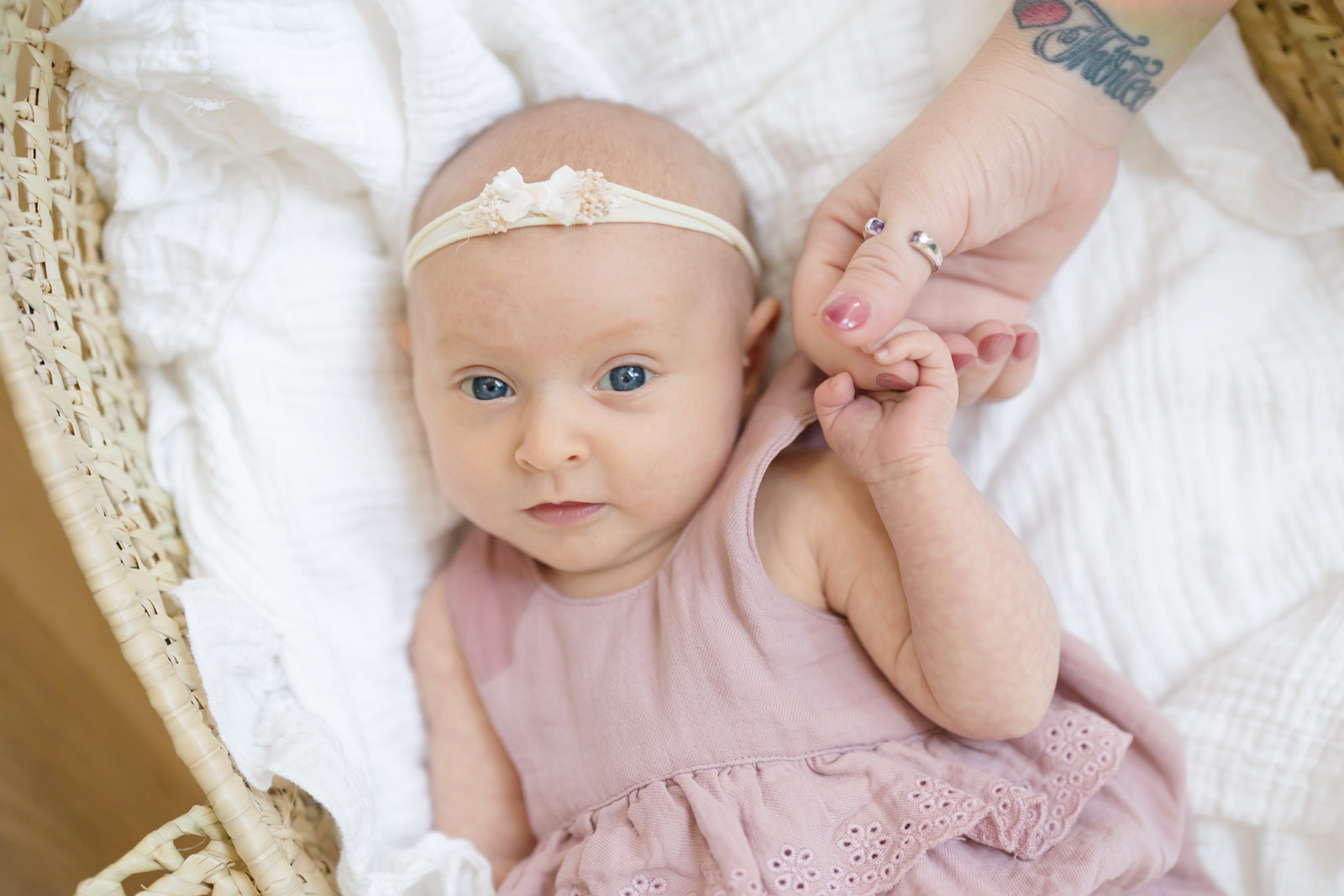 Parents choosing outfits for a newborn photoshoot in Fairfield County CT