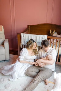 Newborn photographer in Orange CT capturing a family in coordinated outfits
