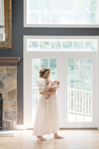 Mom wearing a neutral dress for newborn photography in Fairfield County CT