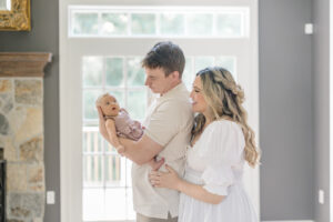 Family coordinating outfits for a newborn photoshoot in Milford CT