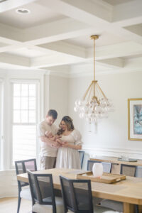 Best newborn photographer in Fairfield County capturing parents holding their baby