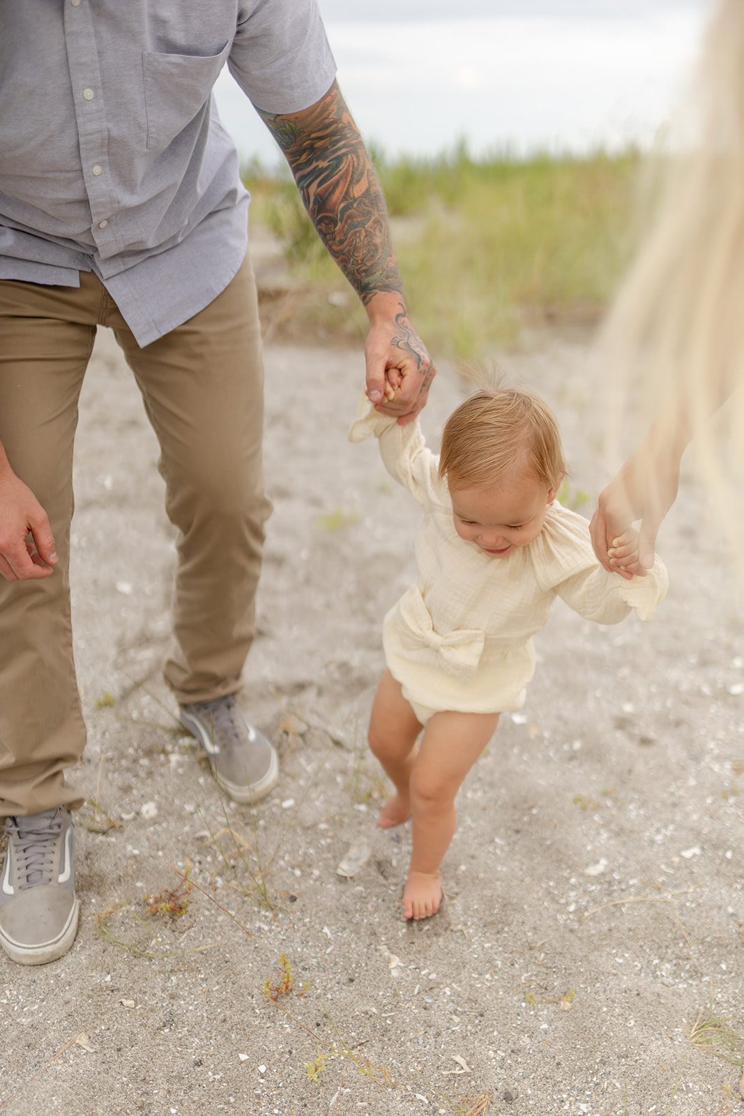 A young girl explores a beach with mom and dad before visiting the Center for Pediatric Therapy Fairfield