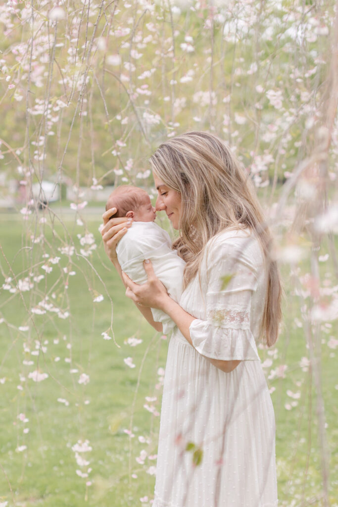 mom and baby in the spring trees