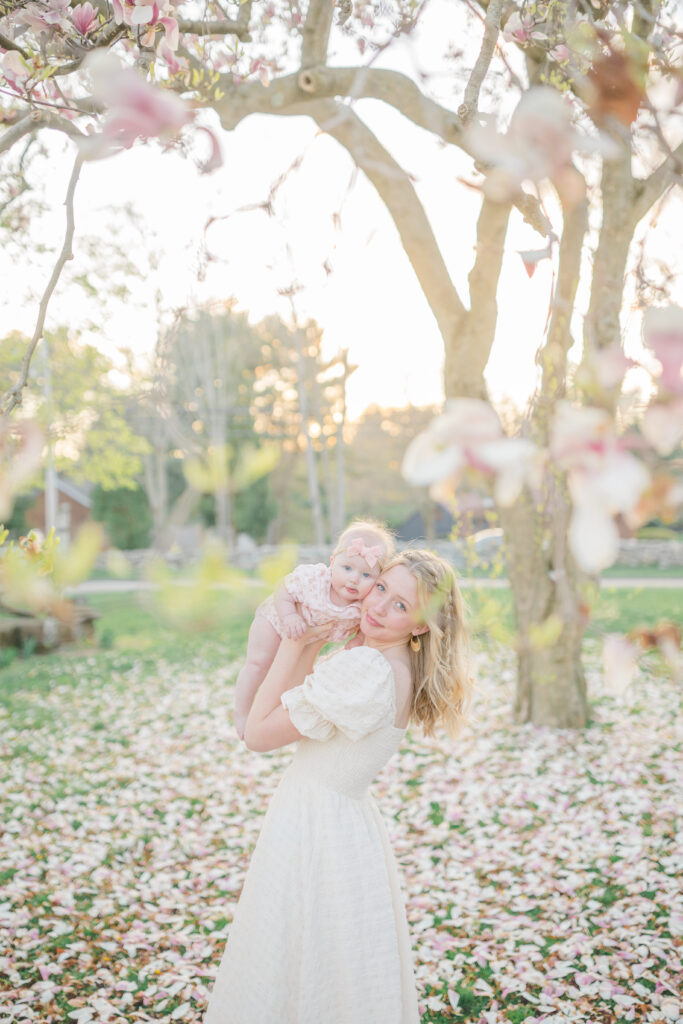 mom and daughter cheek to cheek in connecticut spring blossoms